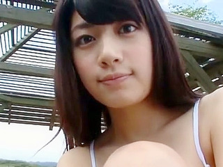 Japanese babe shows off her sexy curves and tight thighs on camera